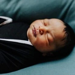 Swaddle Blanket In Midnight With Cloud Trim -Kyte baby Store kyte baby swaddling blanket midnight with cloud trim infant swaddle blanket in midnight with cloud trim 30186285858927